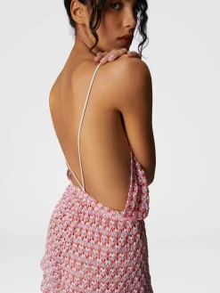 Combinaison courte en dentelle avec dos nu