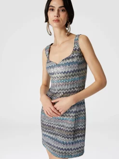 Mini-robe en maille lamée avec décolleté en cœur