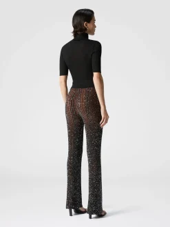Pantalon évasé stretch côtelé à sequins