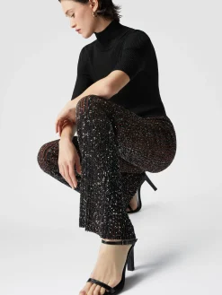Pantalon évasé stretch côtelé à sequins