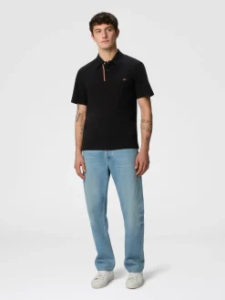 Polo en piqué de coton de couleur unie avec broderie en zigzag et détail contrasté