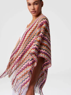 Poncho en maille avec motif chevron et franges