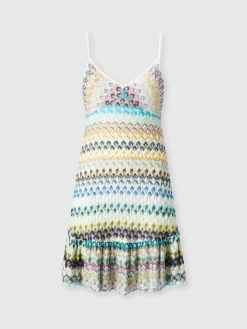 Robe courte sans manches avec jupe à volants en dentelle