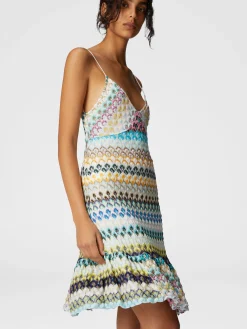 Robe courte sans manches avec jupe à volants en dentelle